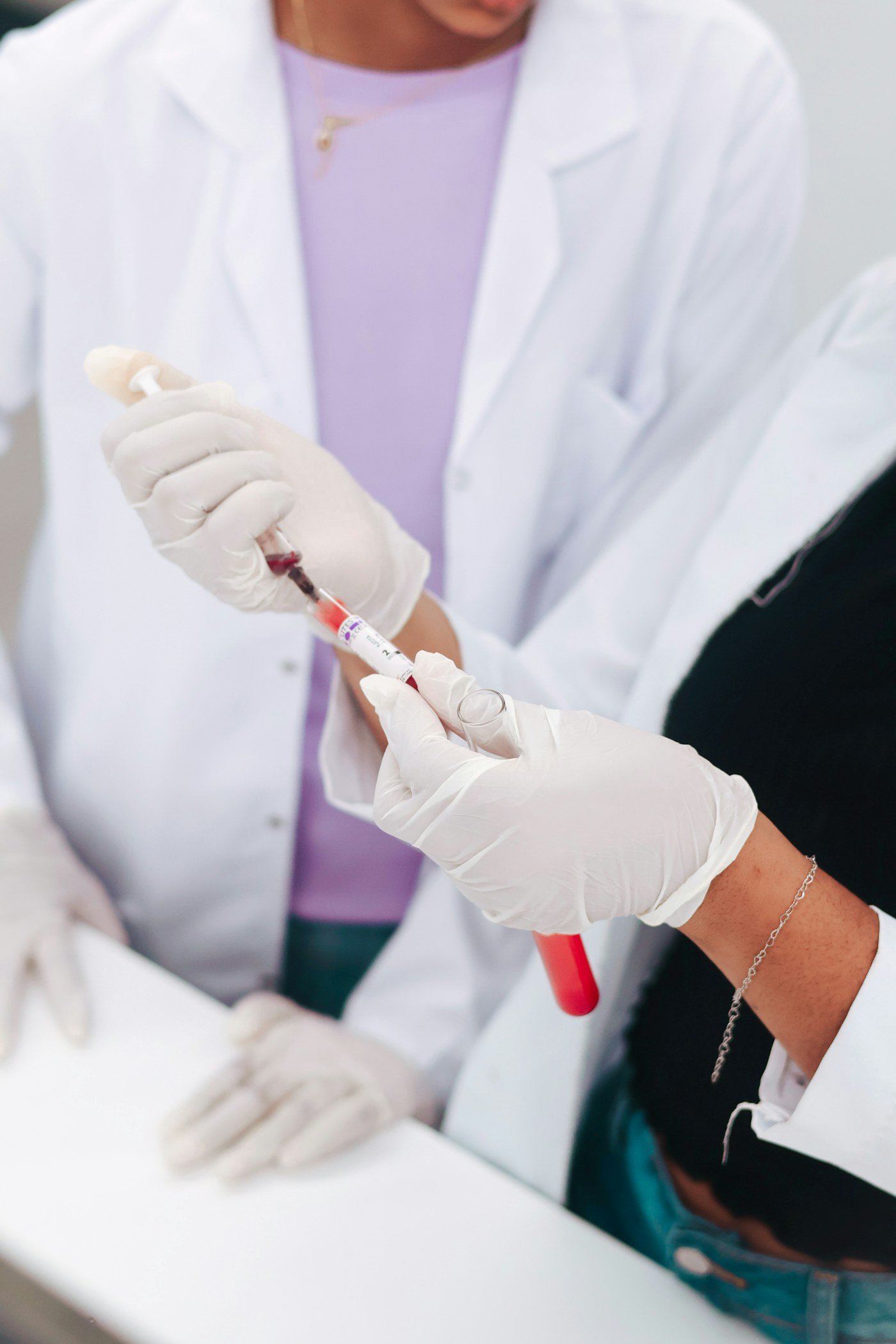 Laboratory professionals examining a blood sample for a Blood Chem 9 panel